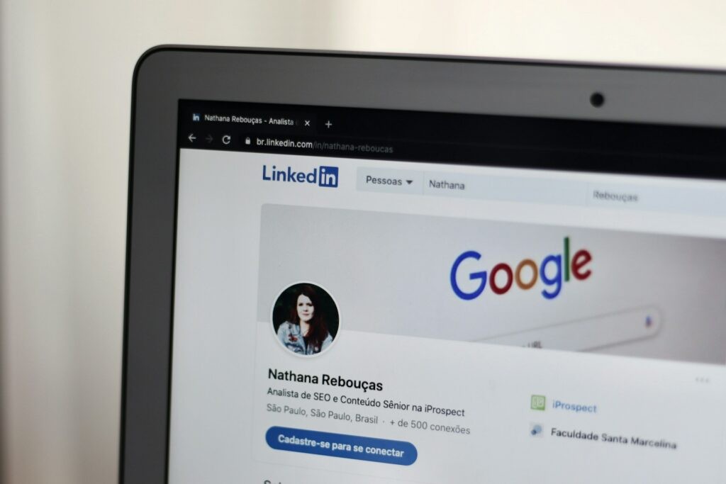 The top left-hand quarter of a laptop screen is showing a LinkedIn profile. 